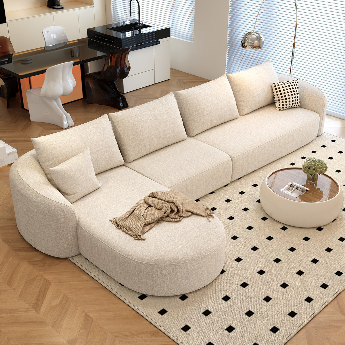 Black modular sectional sofa with right-facing chaise in a modern living room
