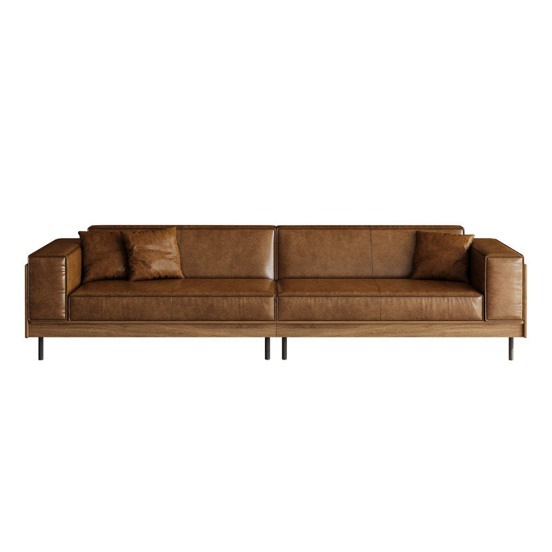 Alternate view of Furnishiaa modern brown 4-seater faux leather sofa with wooden accents and three pillows