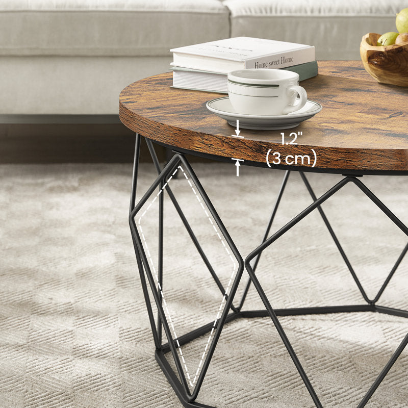 Furnishiaa industrial round coffee table in Rustic Brown showing geometric black steel base from a side angle